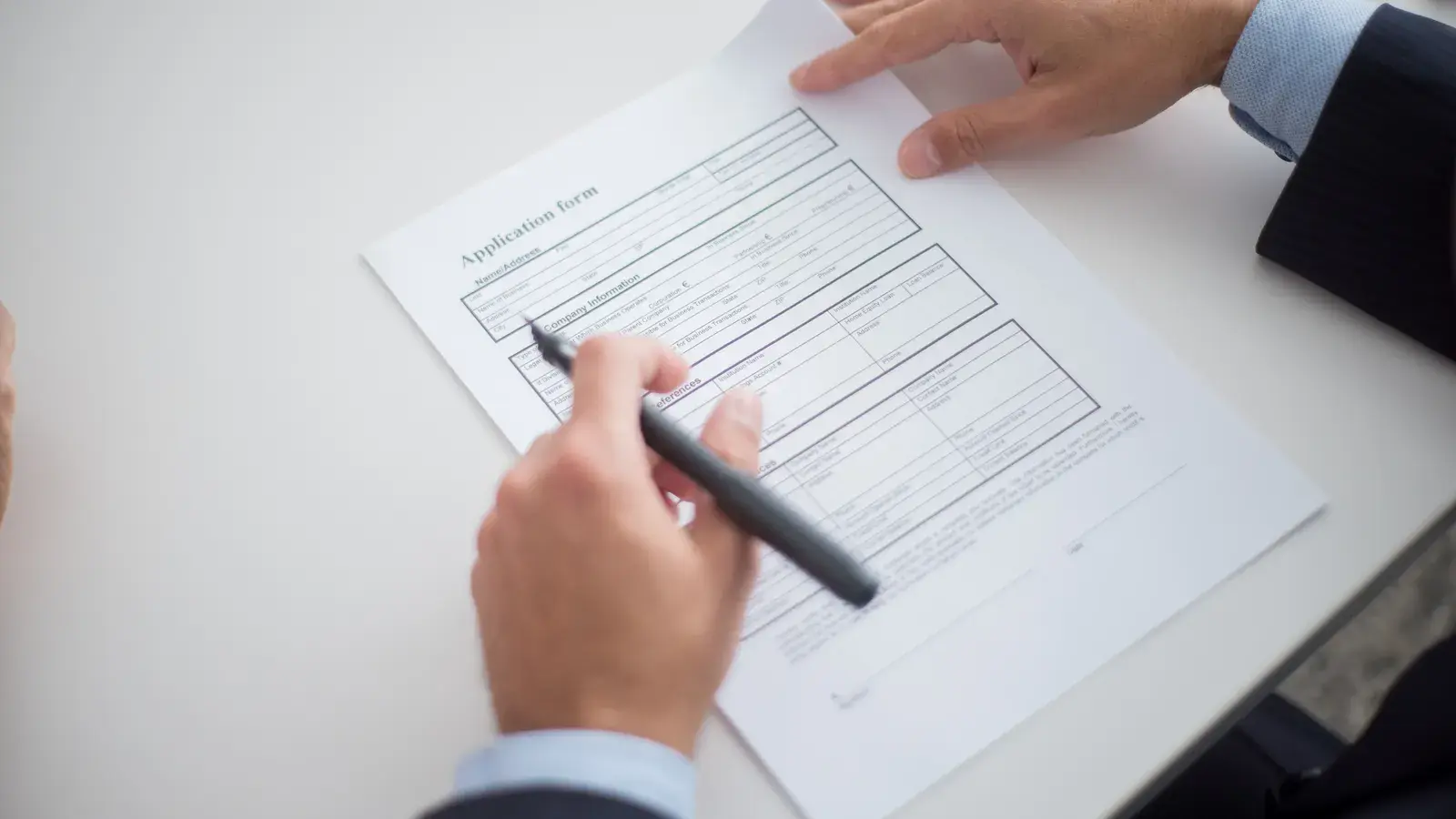 Close up of a business professional reviewing an application 479c46