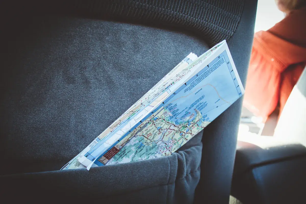 Folded map tucked into a car seat pocket