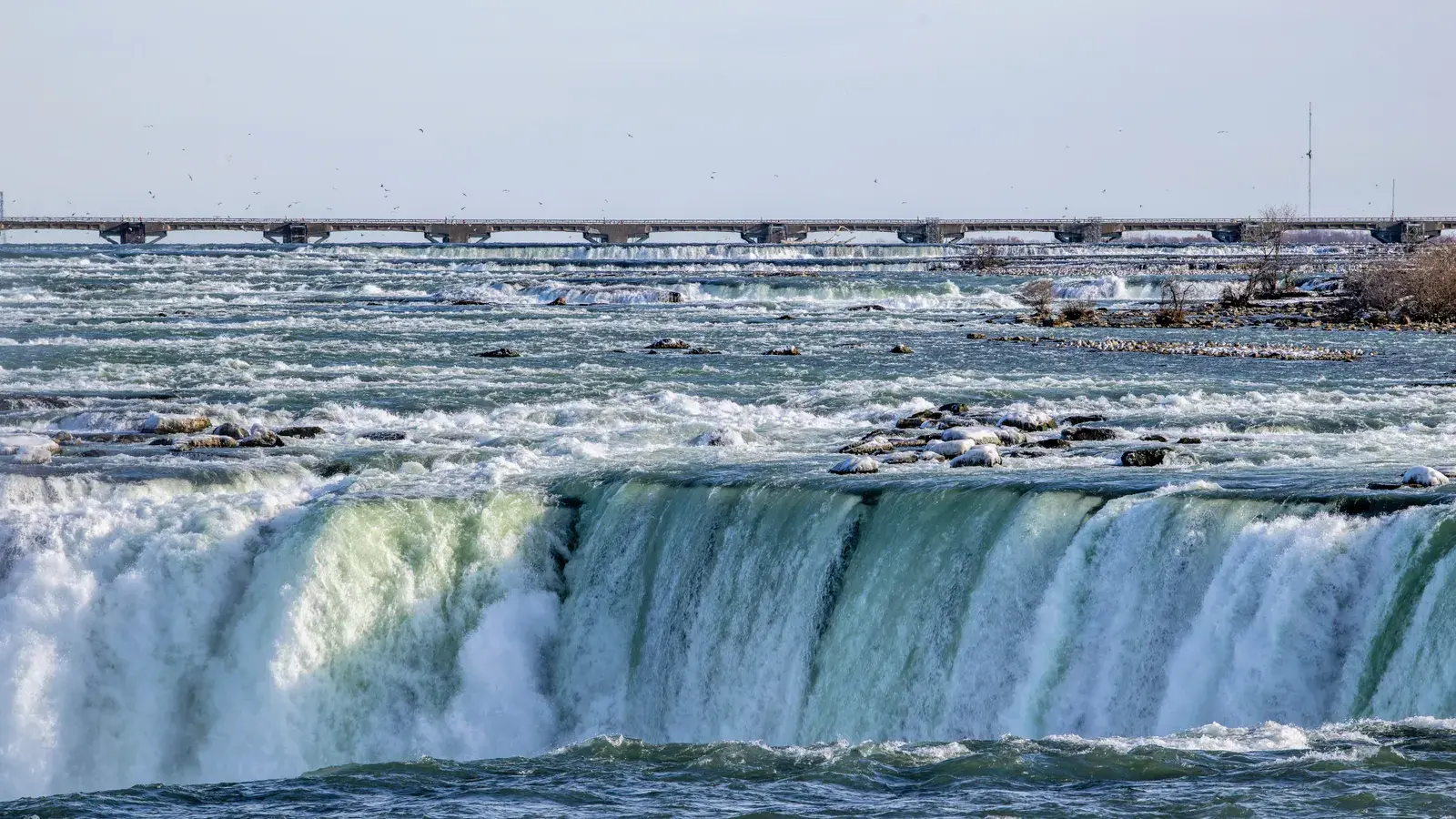 Scenic view of niagara falls with cascading water and a c43304