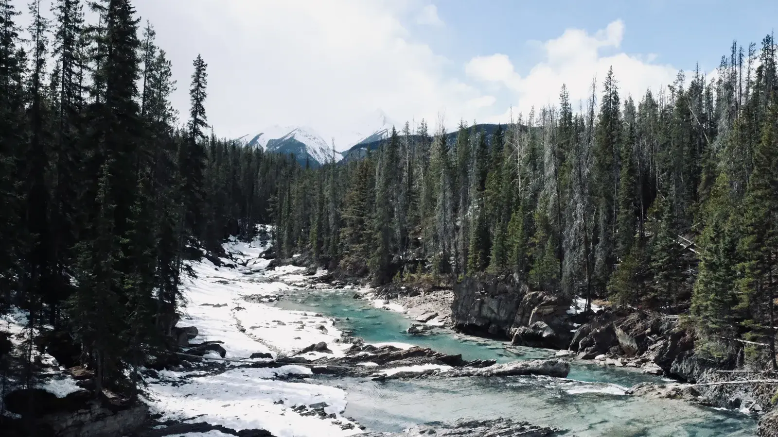 Breathtaking winter view of a serene river flowing through 7b77a8
